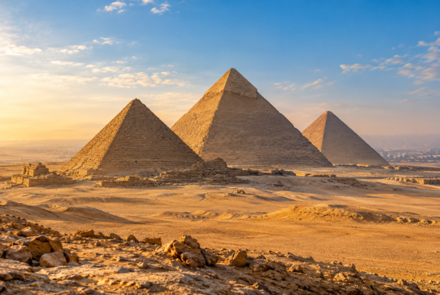 AI-generated illustration of the pyramids at Giza in golden light